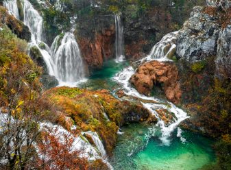 A scenic high angle shot of waterfalls from Plitvice Lakes National Park located in Plitvicki, Croatia